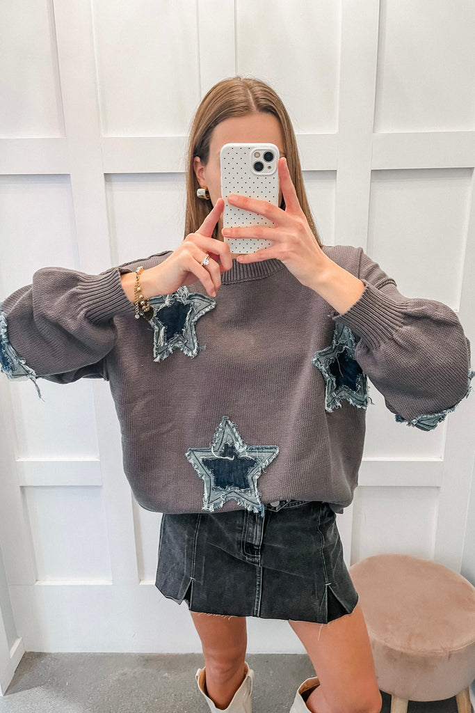 sweater with frayed star patches