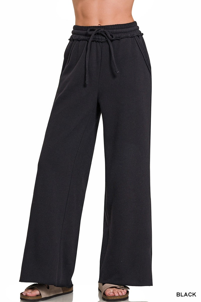 Black wide-leg pants with a drawstring waist on a white background