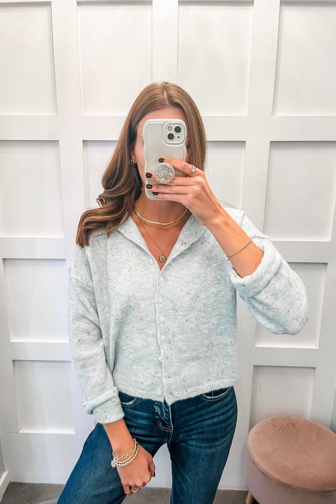 light blue speckled cardigan with button front and relaxed fit