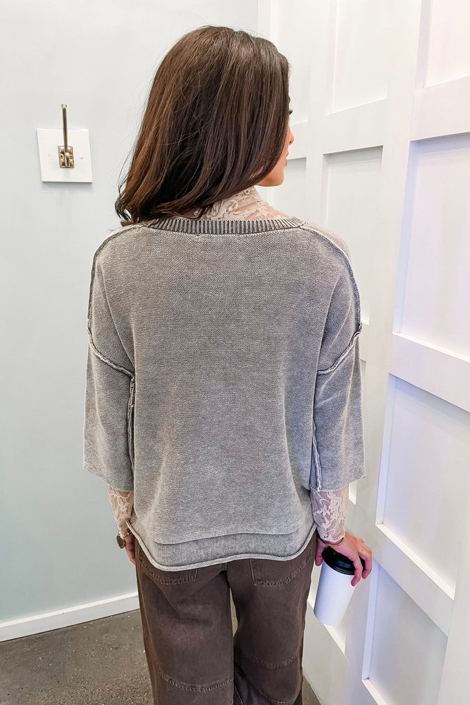 grey exposed seam sweater