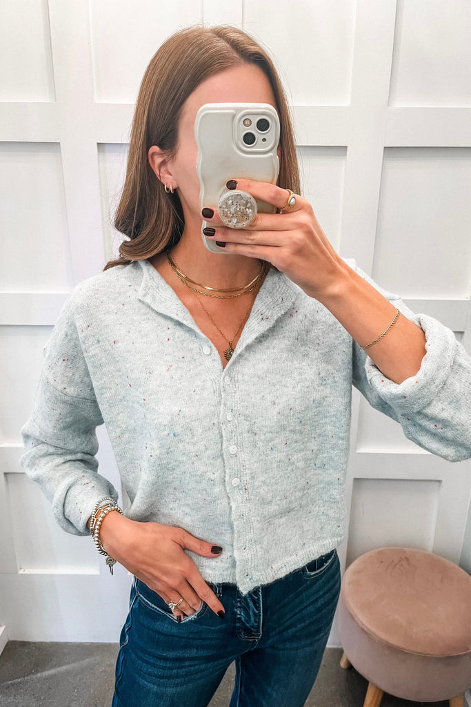 light blue speckled cardigan with button front and relaxed fit