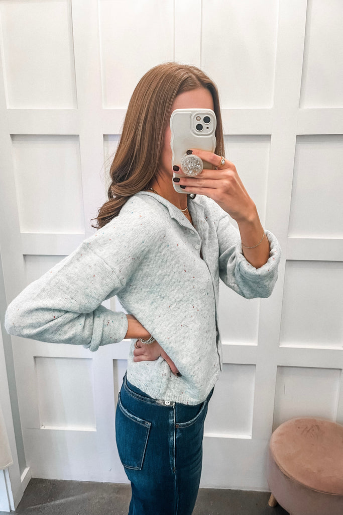 light blue speckled cardigan with button front and relaxed fit
