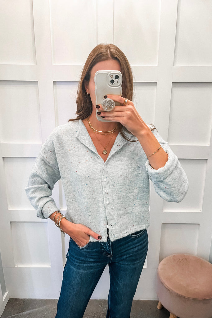 light blue speckled cardigan with button front and relaxed fit