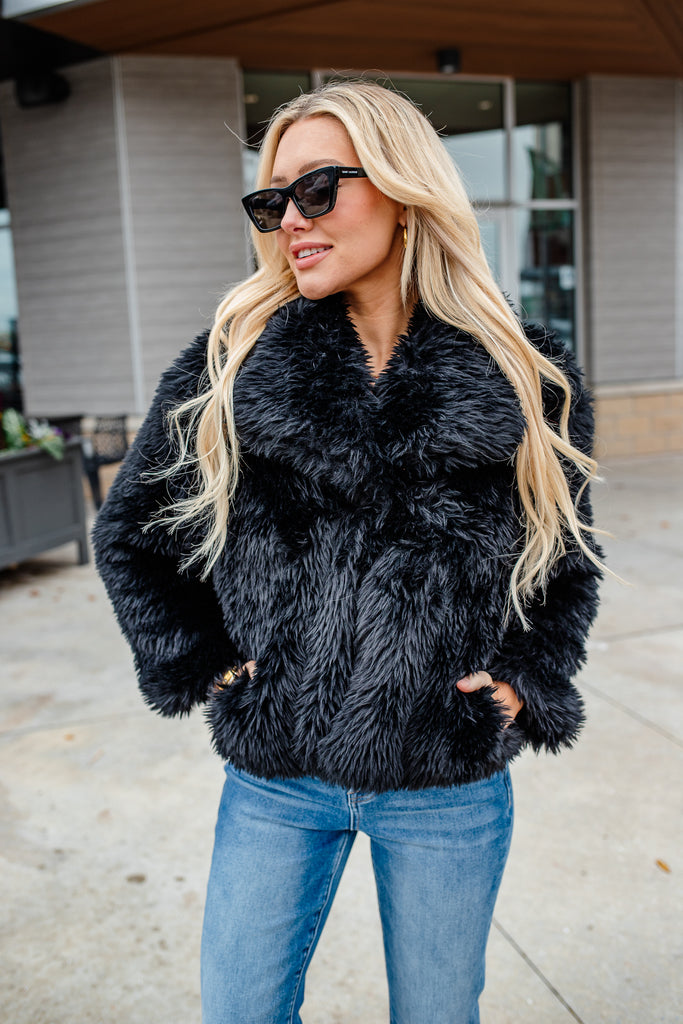 black faux fur coat