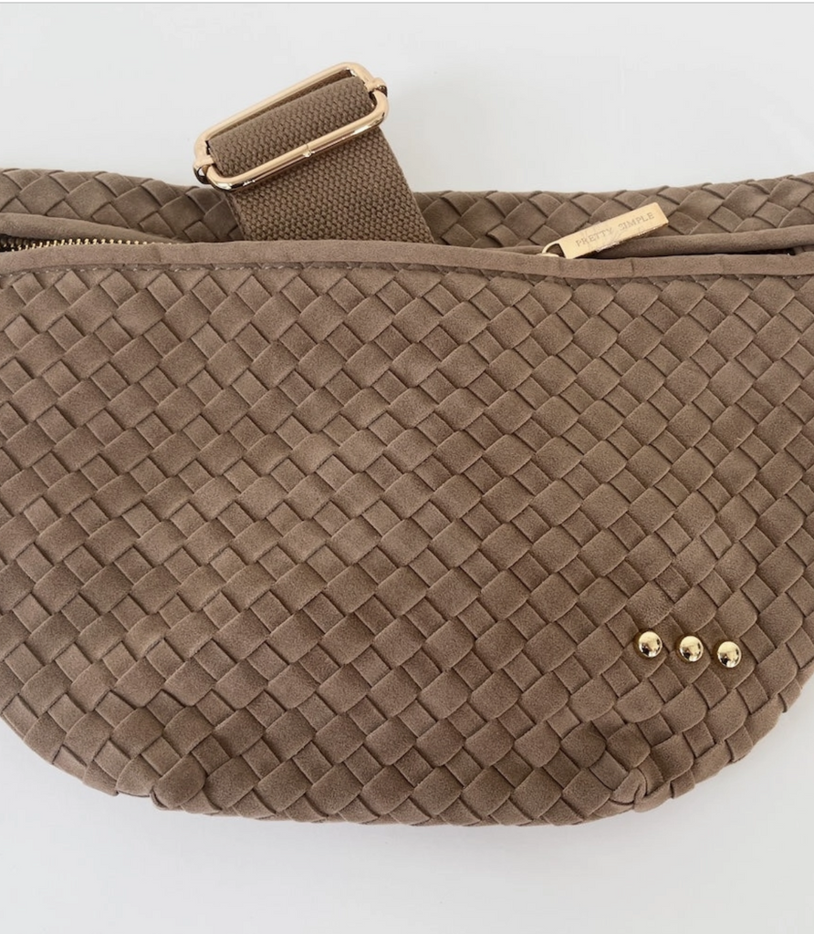 Brown woven waist bag with gold accents on a white background